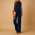 Women’s chic wide leg jumpsuit with round neckline and mid-waist fit, available in multiple colors, perfect for work, evenings, and special occasions.