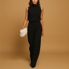 Women’s elegant halter jumpsuit with wide legs, high waist, and decorative bow, perfect for parties, dinners, and festive occasions.