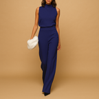 Women’s elegant halter jumpsuit with wide legs, high waist, and decorative bow, perfect for parties, dinners, and festive occasions.