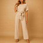 Women’s high waist jumpsuit with lace-up detail and flattering fit, available in multiple colors, perfect for work, evenings, and chic occasions.