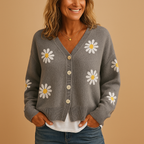 Women’s knitted cardigan with button closure and elegant floral pattern, designed for autumn and winter layering in casual or refined outfits.