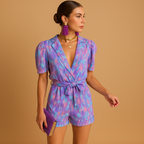 Women’s printed short jumpsuit with a flattering waist belt and vibrant design, perfect for summer days, casual outings, and evenings out.