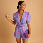 Women’s printed short jumpsuit with a flattering waist belt and vibrant design, perfect for summer days, casual outings, and evenings out.