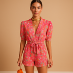 Women’s printed short jumpsuit with a flattering waist belt and vibrant design, perfect for summer days, casual outings, and evenings out.