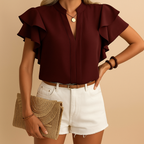 Women’s sleeveless blouse with refined cut and lightweight fabric, perfect for work, evenings out, or casual elegant outfits.