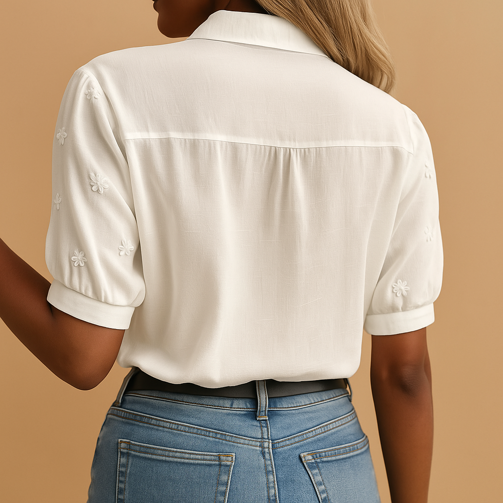 Women’s white blouse with classic collar, button closure, and light tailored fit, perfect for work, casual days, and evenings out.